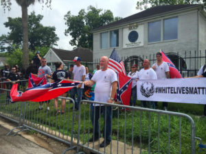 Demonstrators gathered with a White Lives Matter sign in front of the N.A.A.C.P. office in Houston last week. Credit Darla Guillen/Houston Chronicle, via Associated Press.